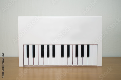 White midi keyboard with knobs and pads