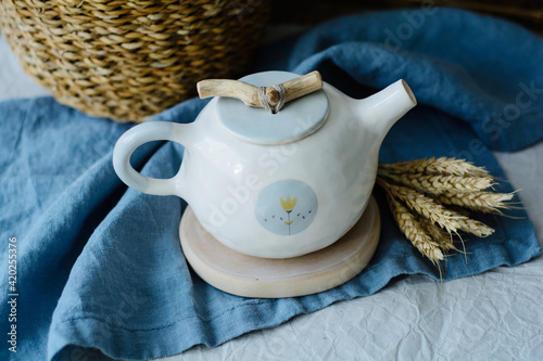 Handmade ceramic craft ware. Teapot. photo