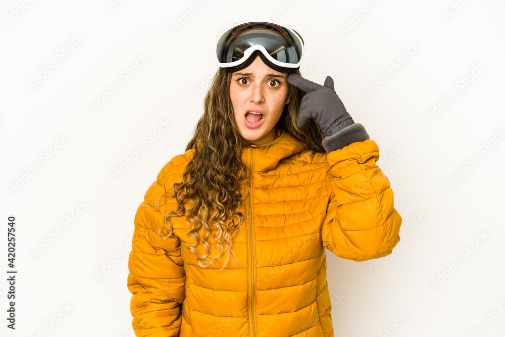 Young caucasian snowboarder woman isolated showing a disappointment gesture with forefinger.