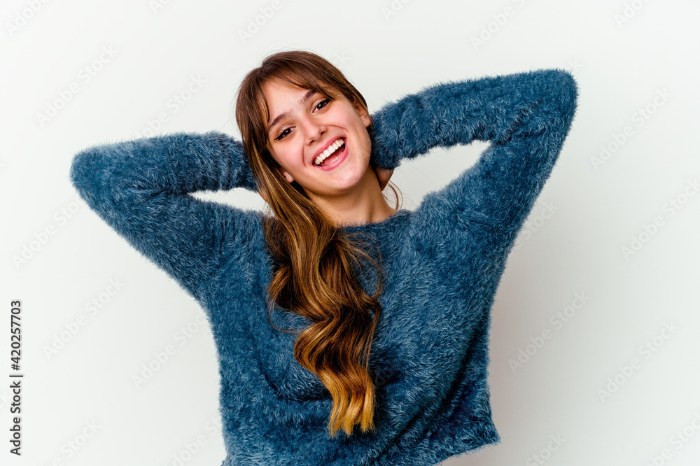 Young caucasian cute woman isolated on white background feeling confident, with hands behind the head. Young caucasian cute woman isolated on white background feeling confident, with hands behind the head.