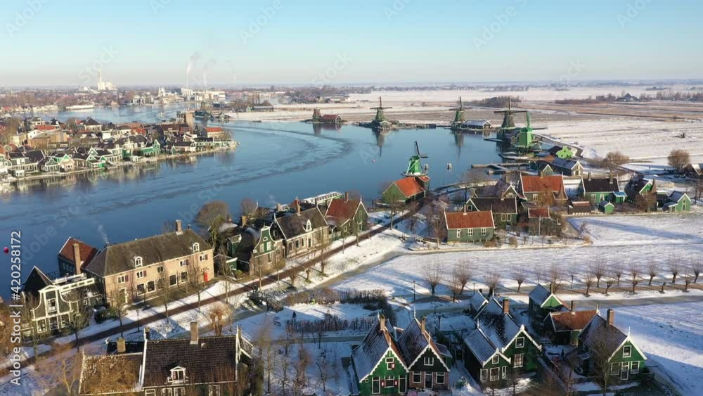 Drone flight of historic houses at the famous Zaanse Schans, stunning Winter scenery in the Netherlands.
