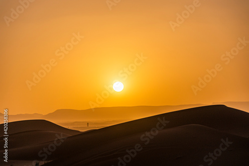 Sunset between sand dunes © jawad
