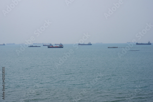 The bulk of the cargo ships at sea await their disembarkation.