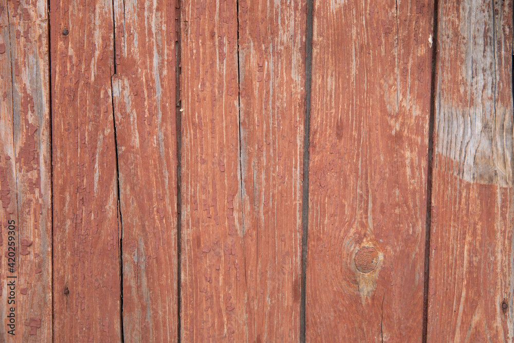 Naklejka premium Wooden background from red planks