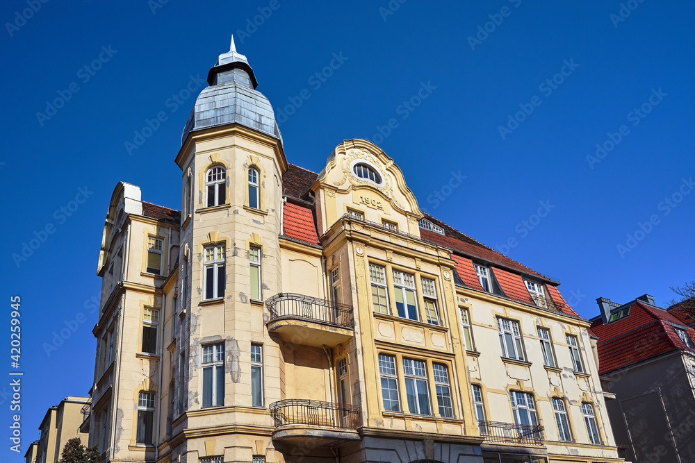 Facade with tower and balconies of historic tenement houses
