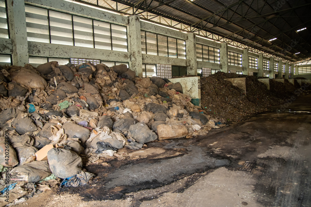 Garbage pile with solid waste in waste disposal plant for make composed fertilizer to argriculture industrial.