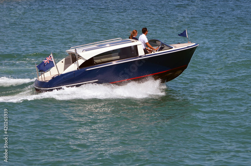 High-end motor boat speeding on the Florida Intra-Coastal Waterway near Miami Beach.