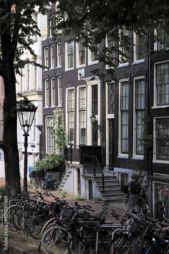 Amsterdam Street View with Canal Houses  Bicycles  and Traditional Lamppost