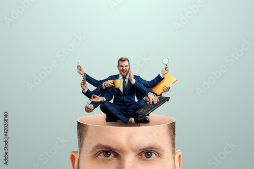 Schilderij op canvas Instead of a brain, a man has a multi-armed businessman in his head