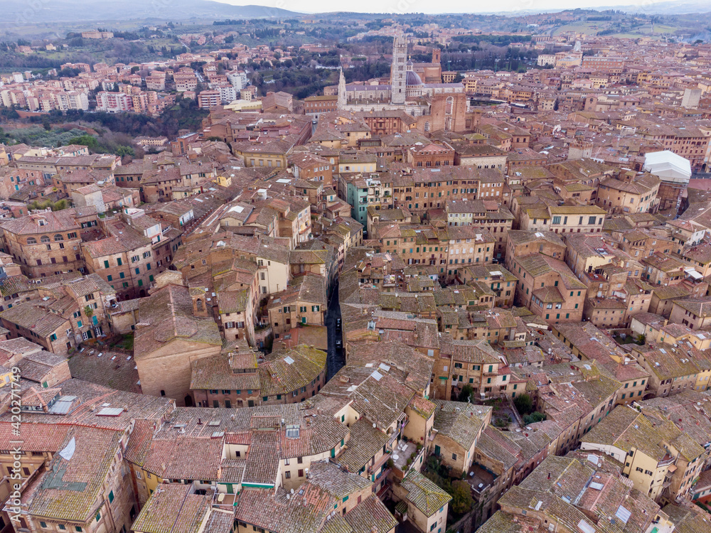 medieval city of Siena in Tuscany seen from the drone