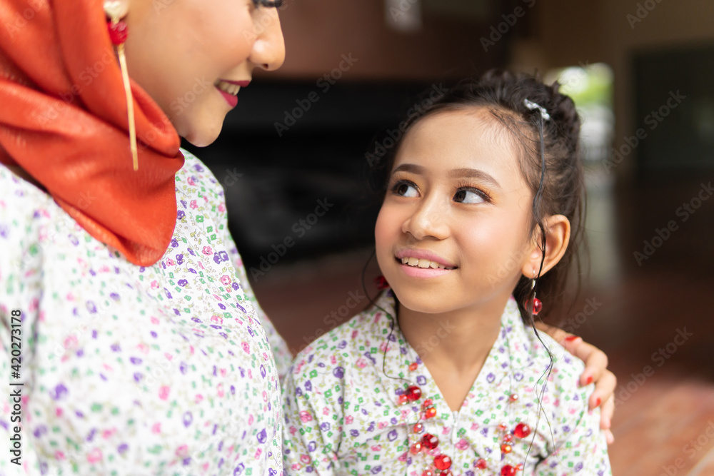 Mother and daughter moment, outdoor wearing traditional dresses Mother and daughter moment, outdoor wearing traditional dresses