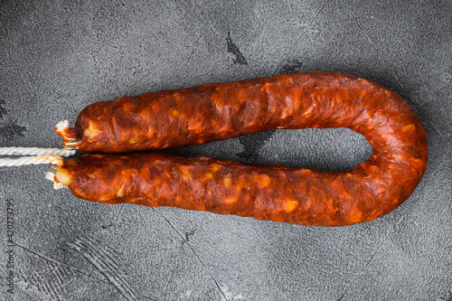 Sausage chorizo salami on grey background