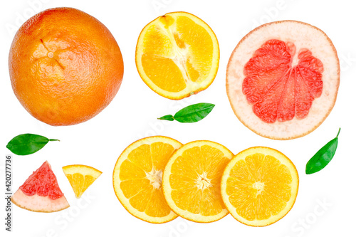 Slices of orange and grapefruit isolated on white  top view