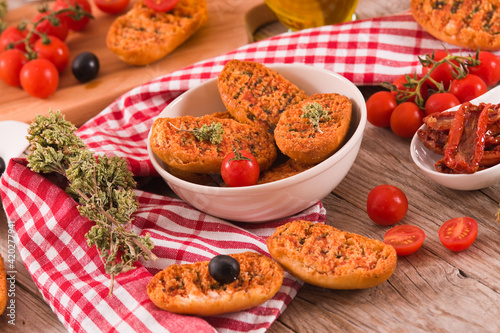 Toasted bread with tomato and oregano. 