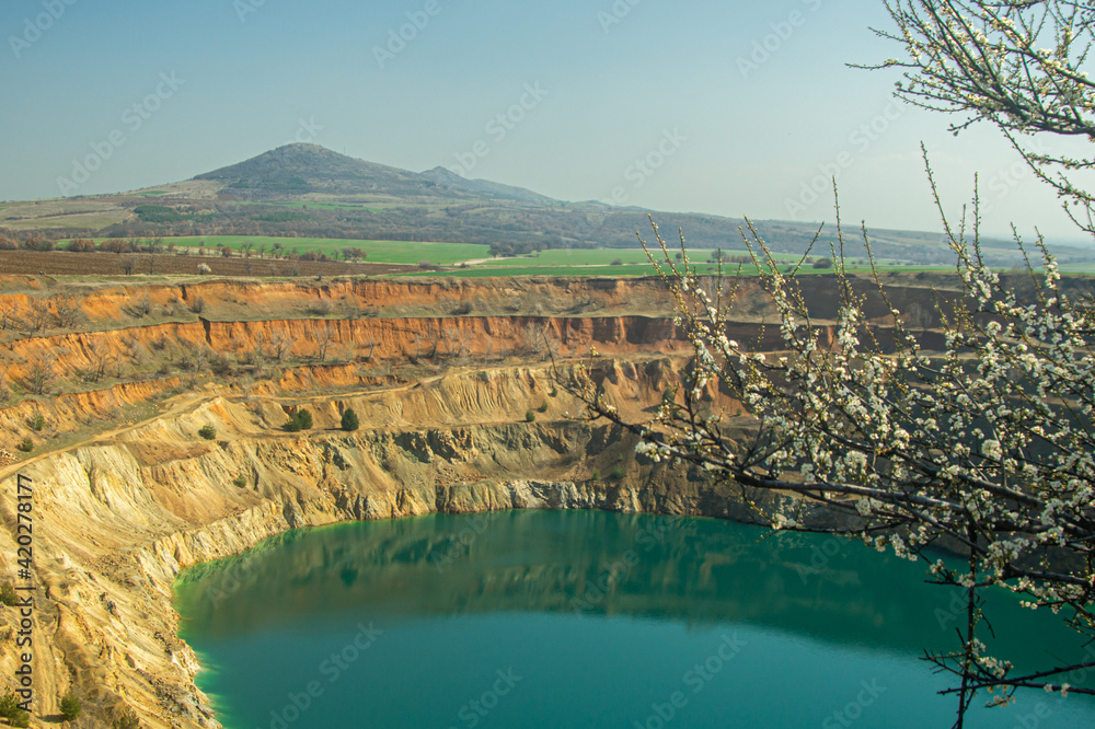 Fototapeta premium late winter view to abandoned Bulgarian mine pit 