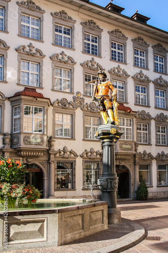 Statue of Willhelm Tell with bow, who is a national hero, standing on the top of a public fountain in Schaffhausen photo