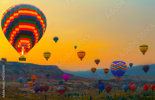 Hot air balloon flying mountain valley Göreme National Park. Rock Sites of Cappadocia Turkey