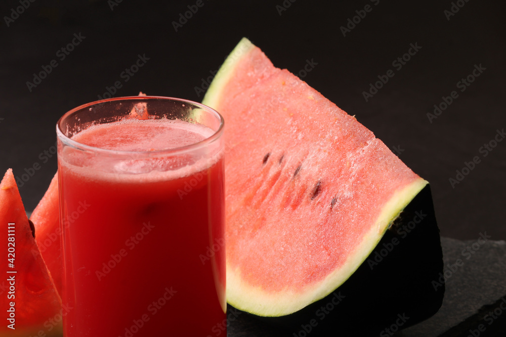 Watermelon smoothies or juice topping with fresh watermelon and mint leaves for summer drinks concept. Watermelon smoothies or juice topping with fresh watermelon and mint leaves for summer drinks concept.