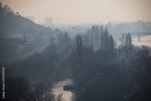 Podoli quarter in Winter haze by Moldau river in Prague, Czech republic