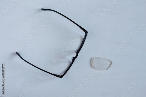 Broken glasses for correcting vision. The lens fell out.