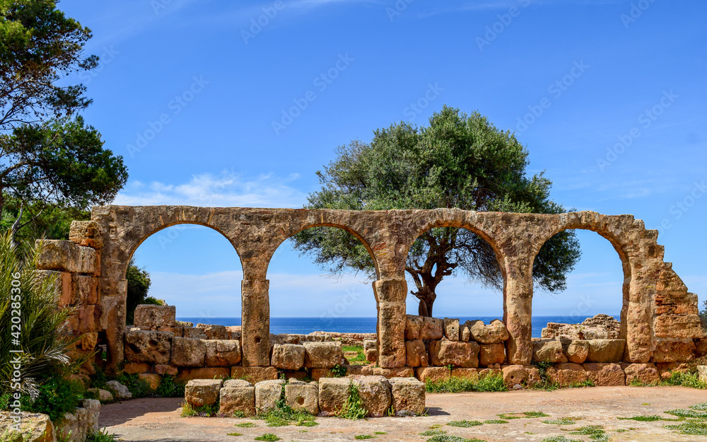The Mediterranean sea through Roman ruins arches