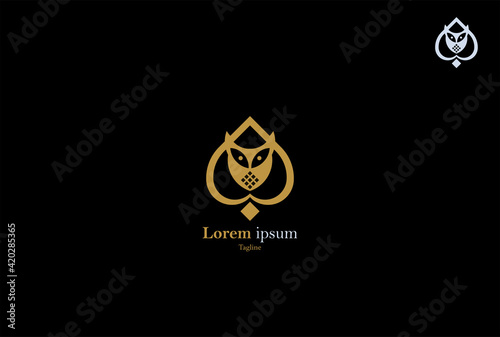 The owl spade logo, formed with minimalistic lines that form an owl and gold spade card, gives it a luxurious look. It's perfect for jewelry logos, or any brand related to spades, owls, shovels  photo