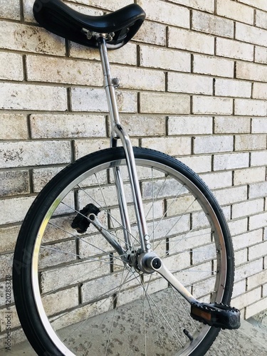 Unicycle resting on the wall