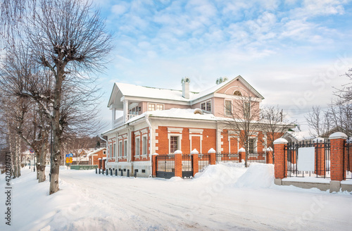 House with a Mezzanine on the Volga River embankment in Plyos in the snow