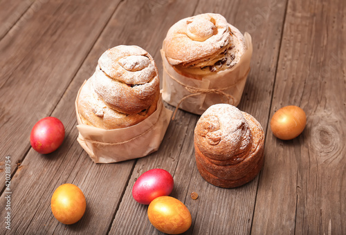 Homemade Easter Kraffins and  eggs on wooden background photo