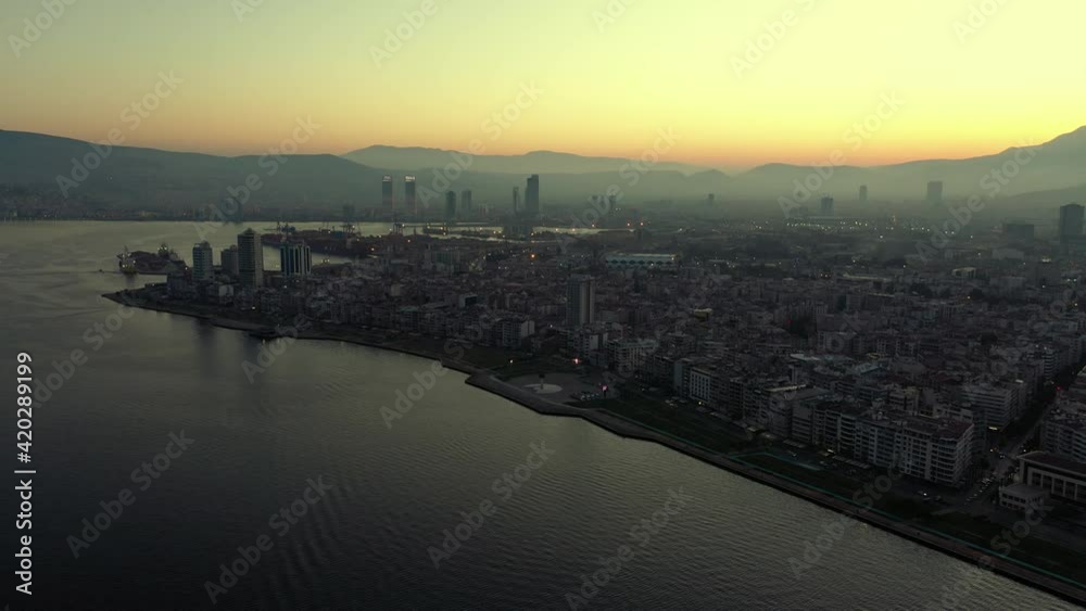 Big metropolis at dawn. View from sea. Big metropolis at dawn. View from sea.