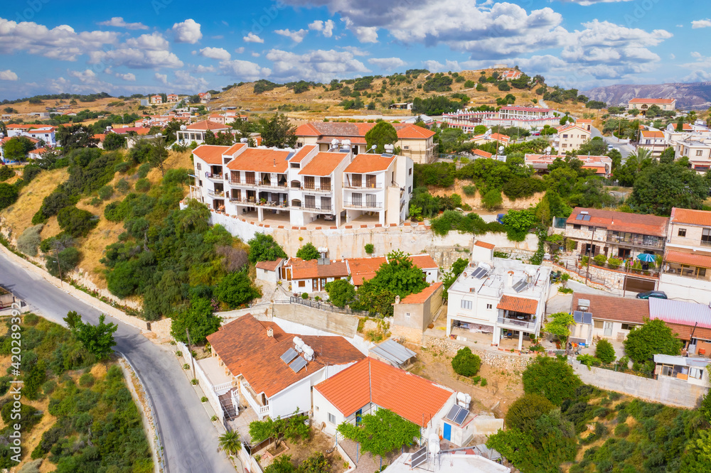 Cyprus Pissouri village. Small village on island of Cyprus. Apartments and houses in Pissouri resort. Panorama of Pissouri from a drone. Highway near the Cypriot village. Mediterranean city