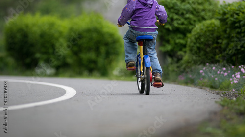 Little cyclist on a little bike (shallow DOF)
