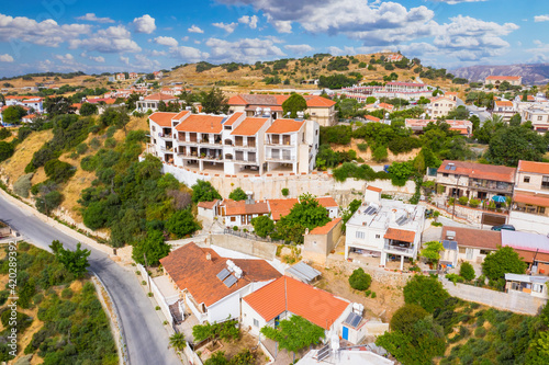 Cyprus Pissouri village. Small village on island of Cyprus. Apartments and houses in Pissouri resort. Panorama of Pissouri from a drone. Highway near the Cypriot village. Mediterranean city © Grispb