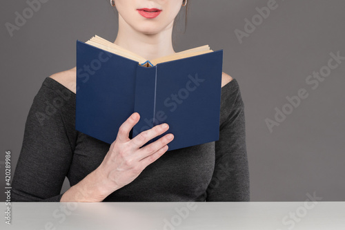 Woman with a book in her ha...
