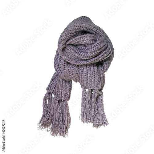 Knitted gray scarf with fringe isolated on a white background. Warm winter scarf of chunky knit, accessory in the cold season
