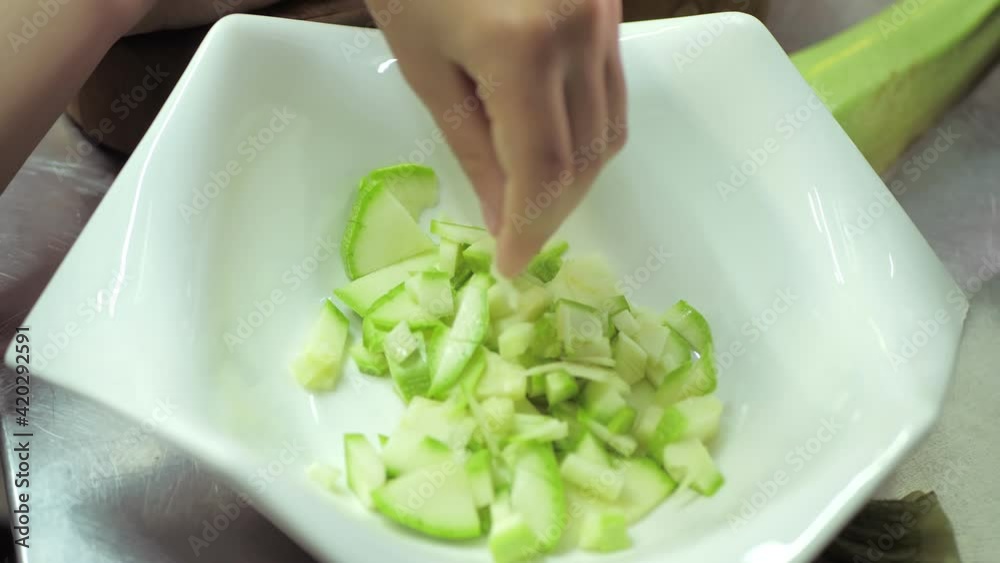 Healthy eating. Children cutting vegetable salad in the restaurant kitchen Healthy eating. Children cutting vegetable salad in the restaurant kitchen