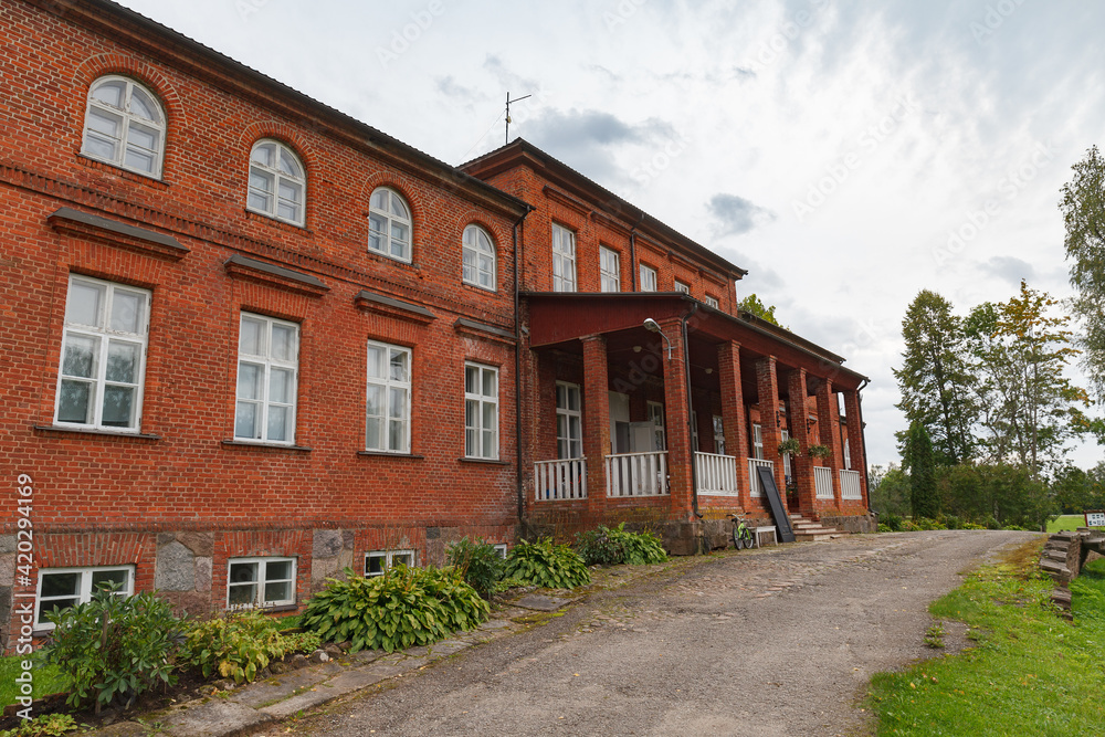 Allikukivi manor, red brick building. Estonia