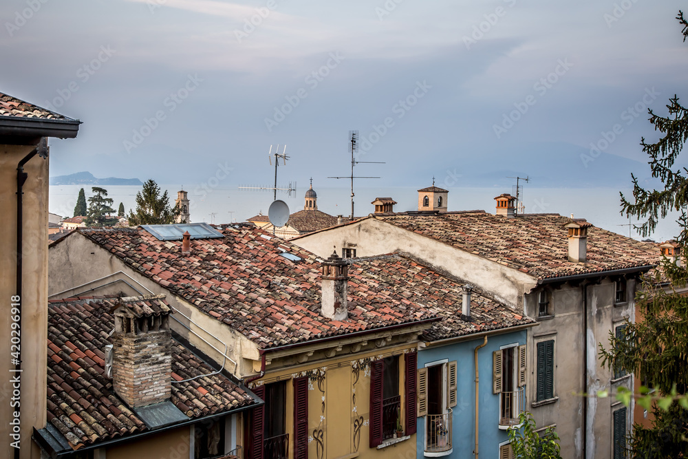 Beautiful view of Desenzano and Lake Garda on an autumn evening. Desenzano, Verona, Italy