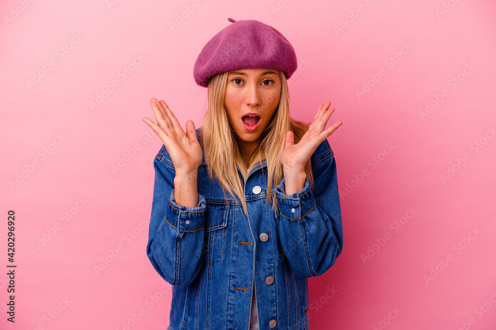 Young mixed race woman isolated on pink background surprised and shocked. Young mixed race woman isolated on pink background surprised and shocked.