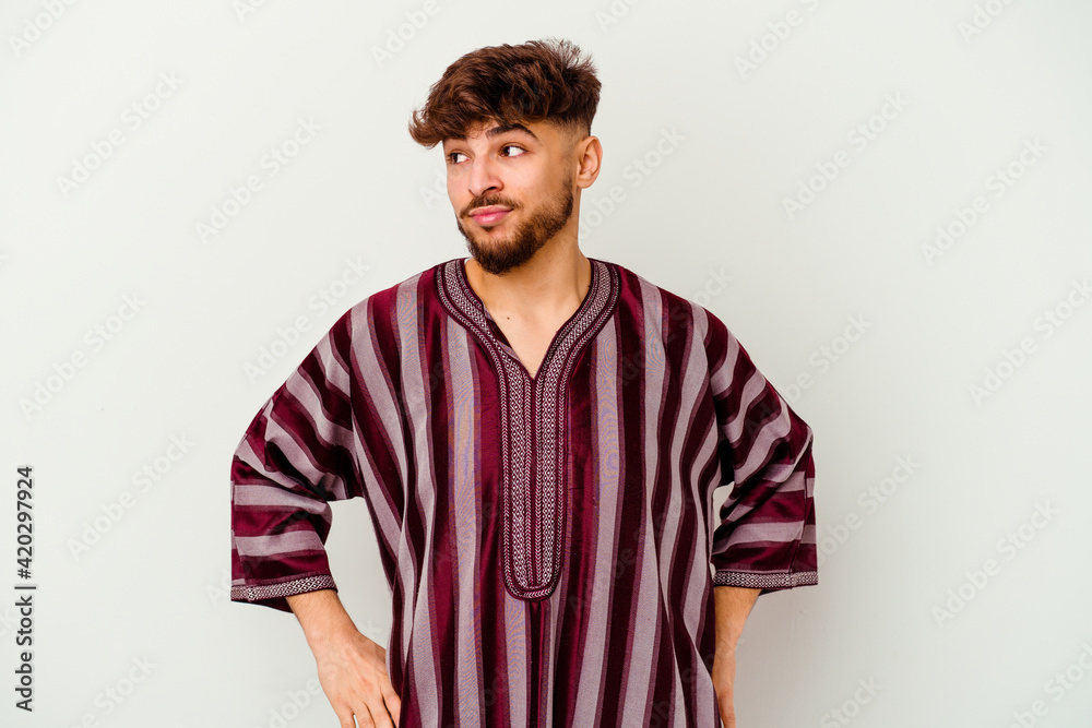 Young Moroccan man isolated on white background confused, feels doubtful and unsure. Young Moroccan man isolated on white background confused, feels doubtful and unsure.