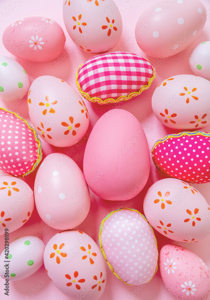 Happy Easter. Pink pastel color eggs variety on pink background