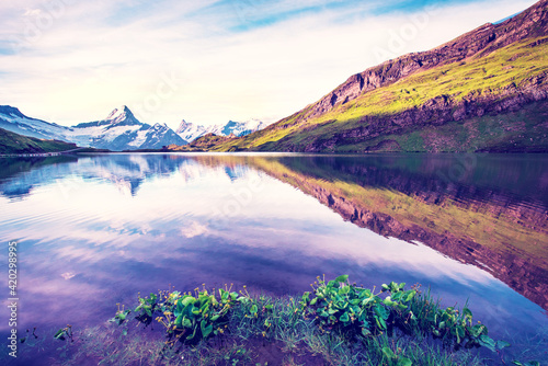 Obraz na płótnie Breathtaking beautiful scenery on the lake in the Swiss Alps. Wetterhorn, Schreckhorn, Finsteraarhorn et Bachsee. Exciting places. (relaxation, harmony, anti-stress - concept). w salonie