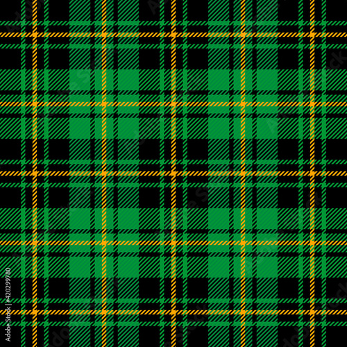 St. Patricks day tartan plaid. Scottish pattern in green and orange cage. Scottish cage. Traditional Scottish checkered background. Seamless fabric texture. Vector illustration