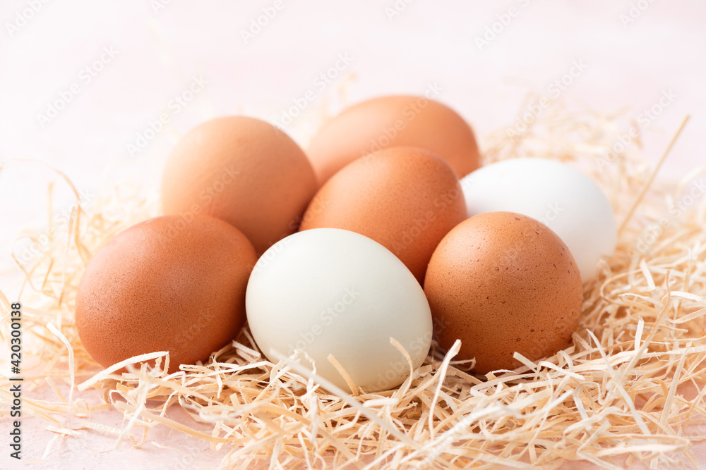 Chicken eggs on pink background closeup view. Easter eggs Chicken eggs on pink background closeup view. Easter eggs