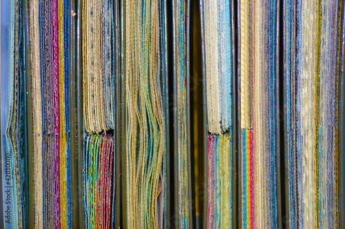stack of books with rainbow cloths