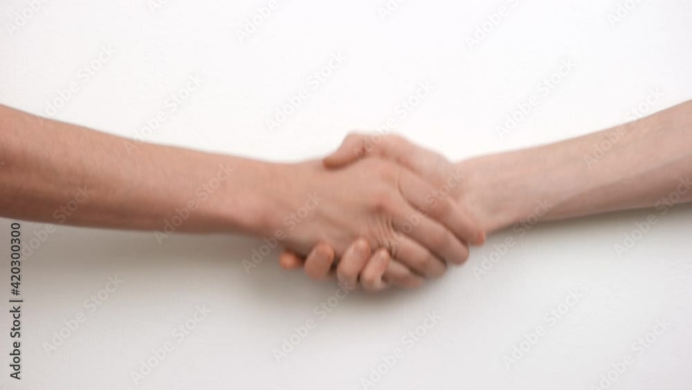 Male handshake on white isolated background. Partnership Male handshake on white isolated background. Partnership