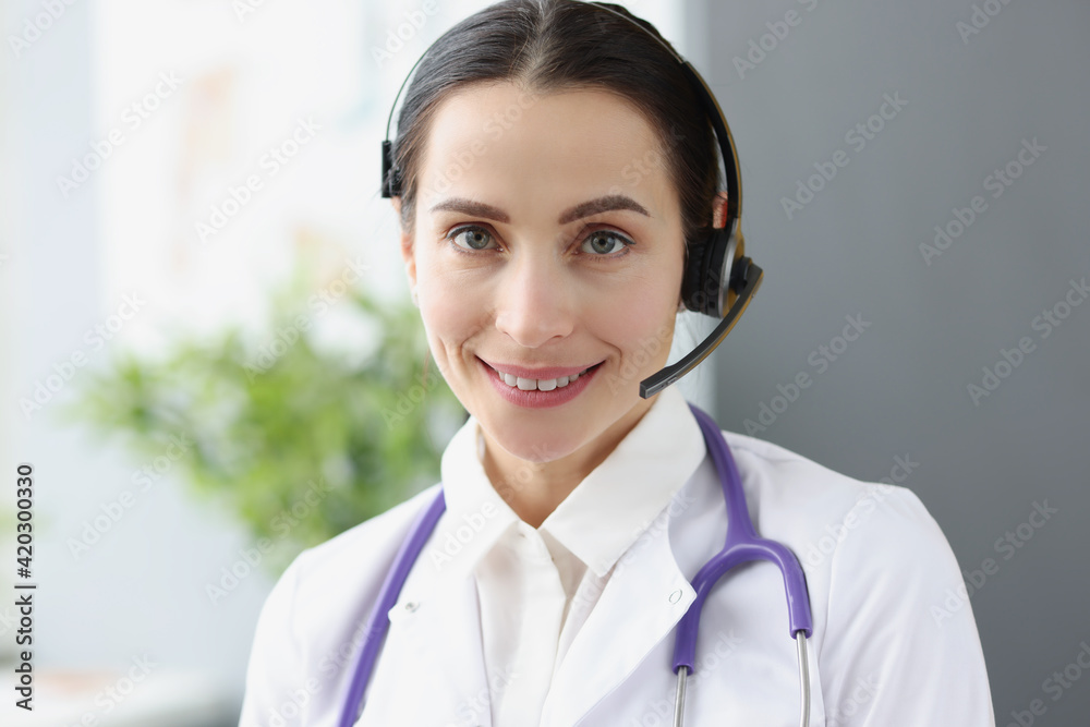 Portrait of doctor operator in headphones for remote work Portrait of doctor operator in headphones for remote work