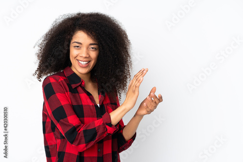 Young african american woman over isolated background applauding © luismolinero