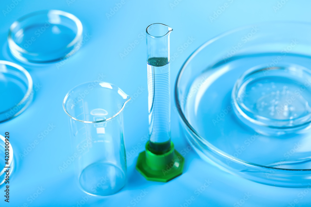 Medical abstract blue background from flasks, test tubes and petri dishes Medical abstract blue background from flasks, test tubes and petri dishes