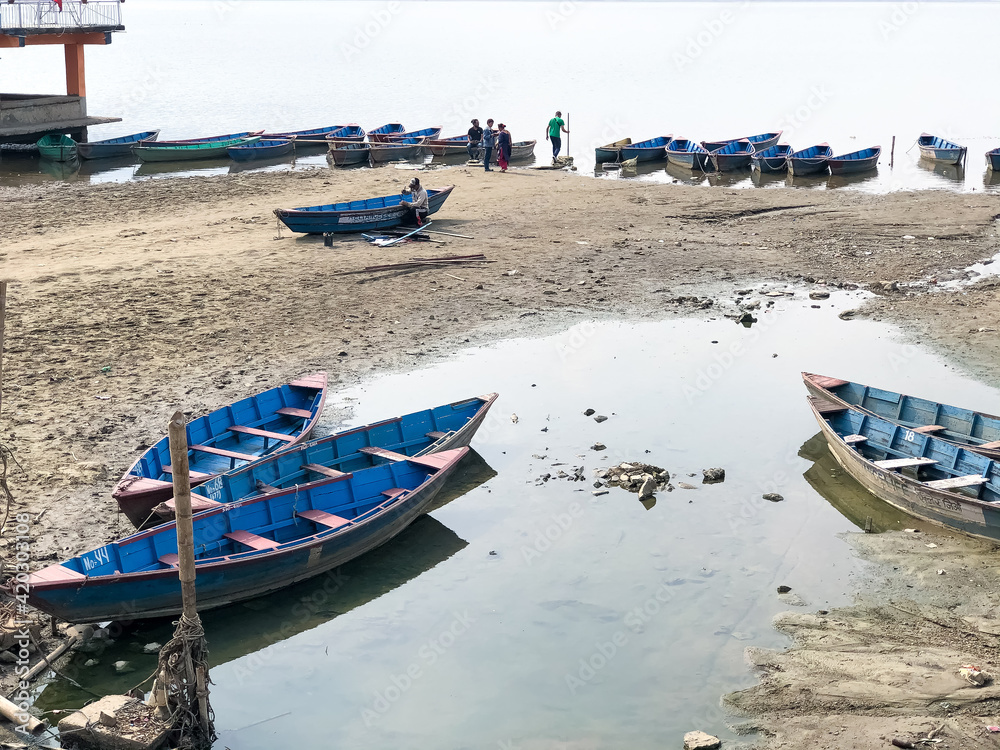 the wooden boats on the beach, boats on the river, fishing boats on the river